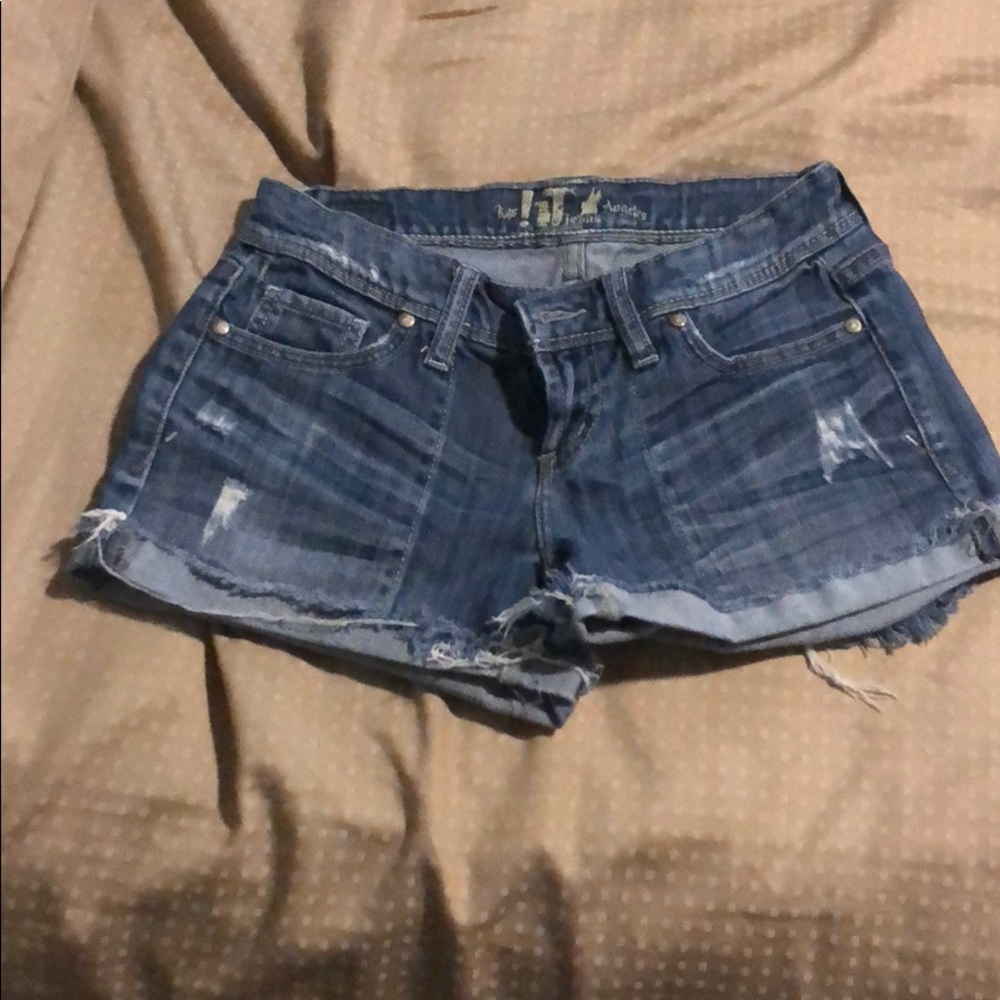 Ripped mid rise blue jean shorts